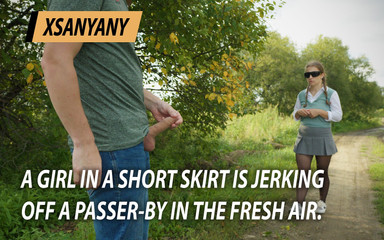 A Girl in a Short Skirt Jerks off a Passerby in the Fresh Air.