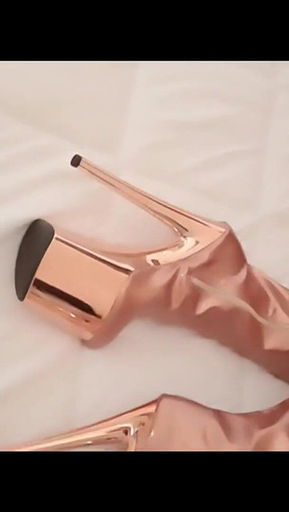 Gold Knee High Boots, Fishnet Stockings, Micro Skirt and a White Mini Top